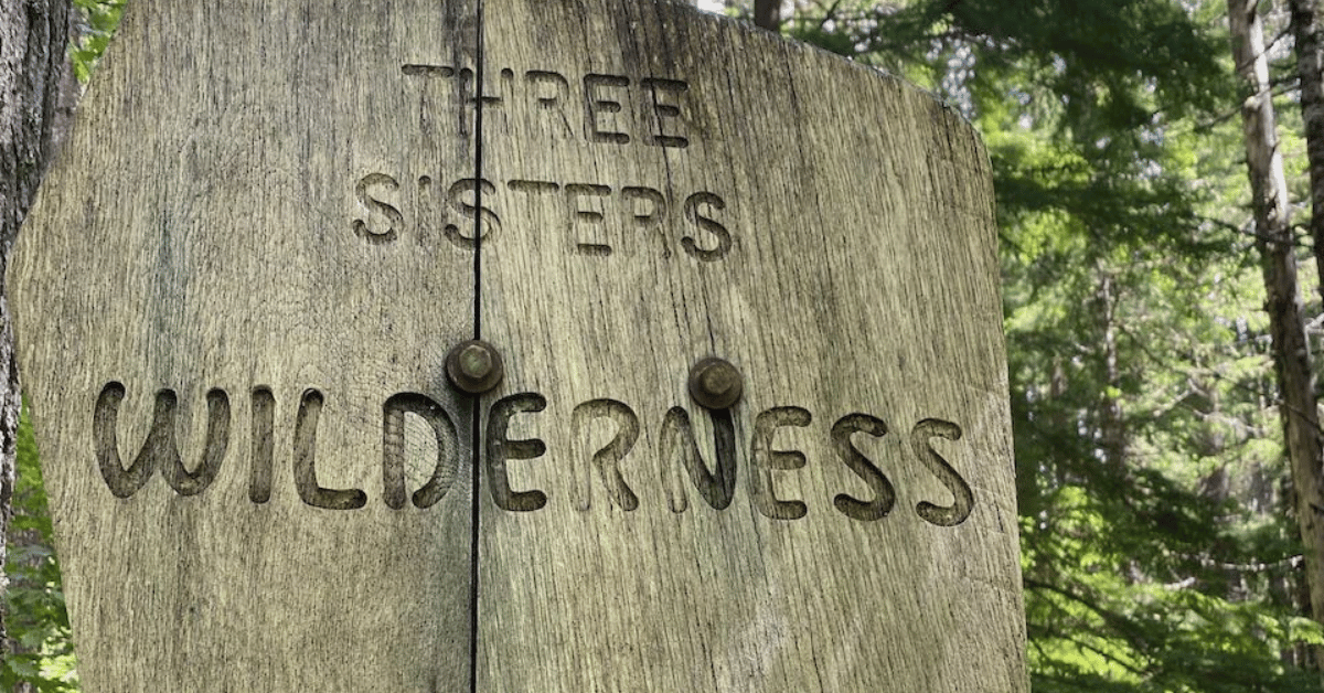 Wood sign signaling the Three Sisters Wilderness